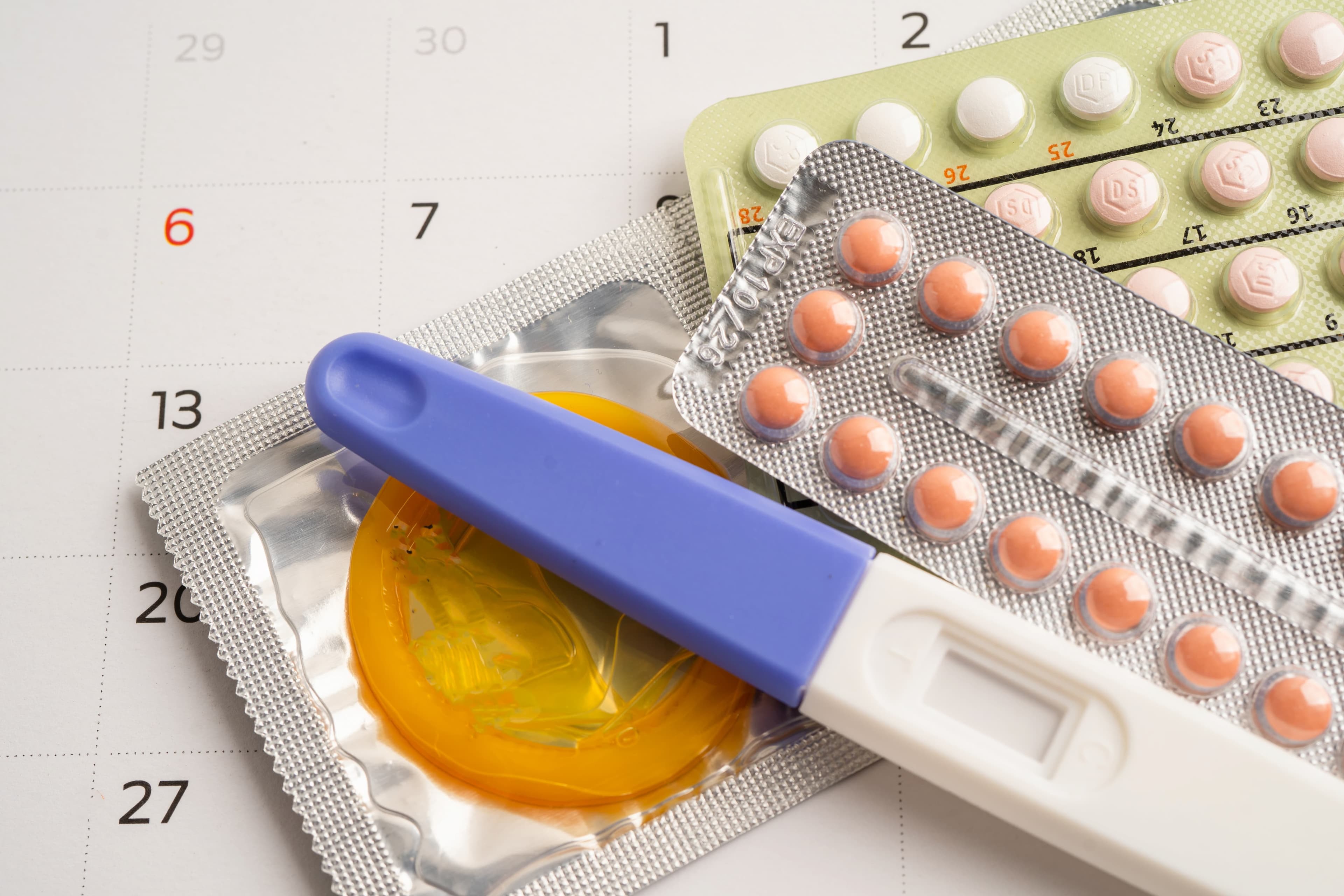 A community health worker speaking with a young woman in a rural community about family planning.