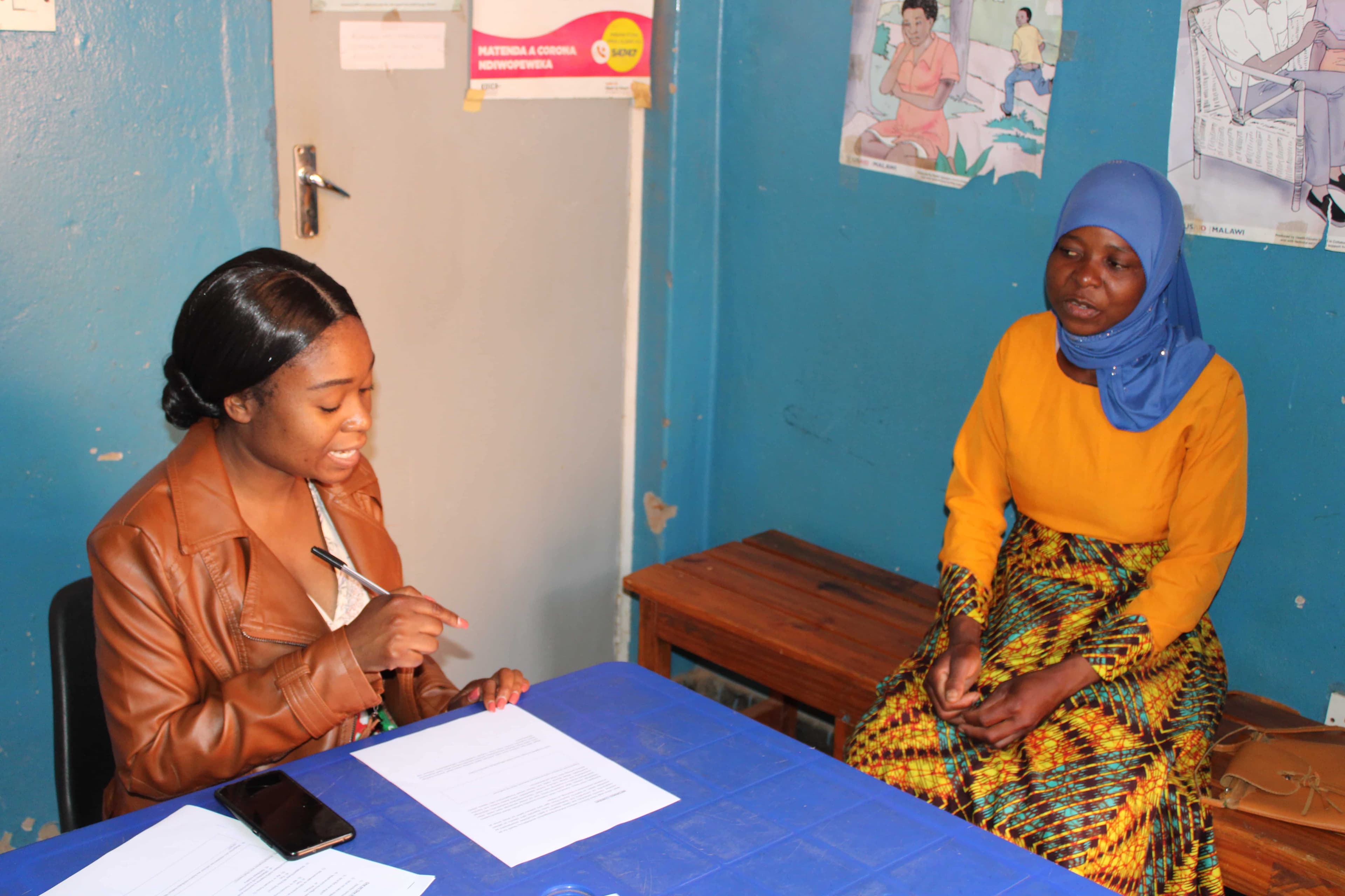 A community health worker engaging with local women.